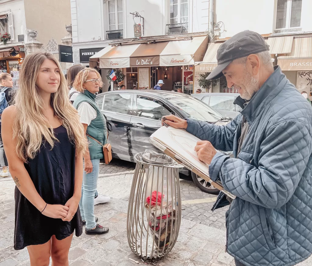 Street artist drawing in Paris