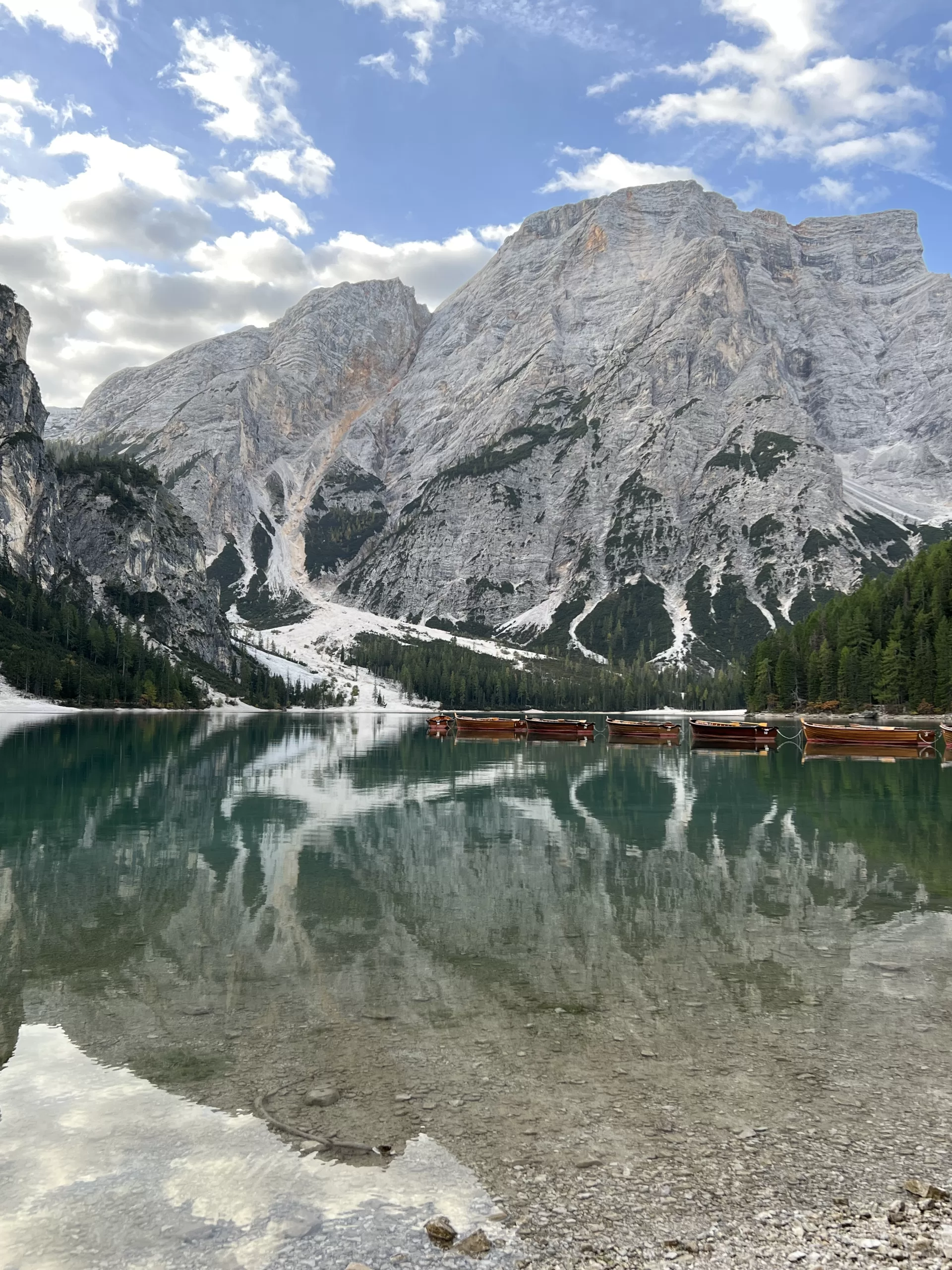 View of mountain and lake with paddleboats